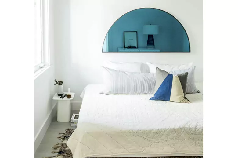 A bedroom with blue statement decorative pieces A bedroom with blue statement decorative pieces