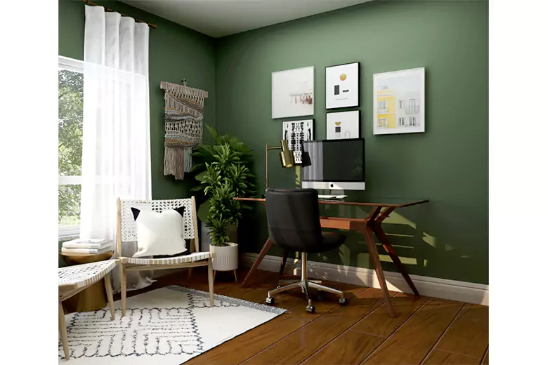 A home office with green walls

