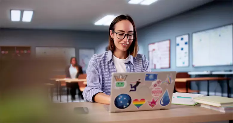 Young student taking an online Photoshop course on her laptop in Bangalore. Young student taking an online Photoshop course on her laptop in Bangalore.