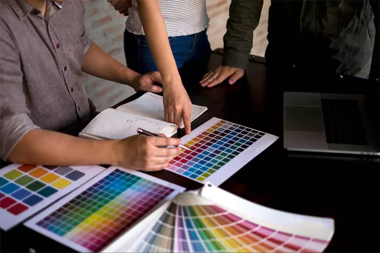 CMYK color model being used by designers for a print design.