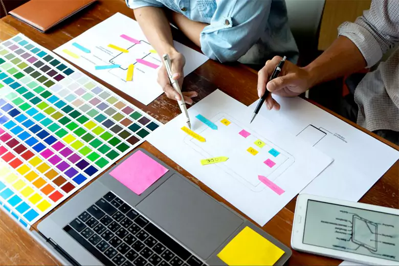 Designers working with CMYK color model