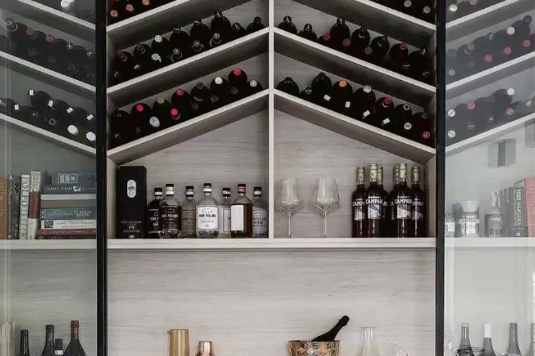 Wine rack displaying wine bottles and glasses, designed for easy storage and access. Wine rack displaying wine bottles and glasses, designed for easy storage and access.