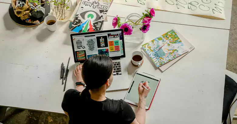 Young professional looking at graphic design programs and doing research