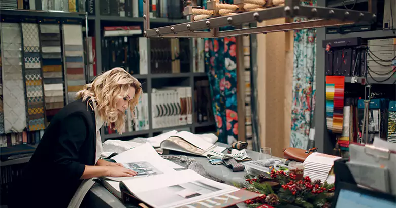 An interior designer working on selecting material for her next project.