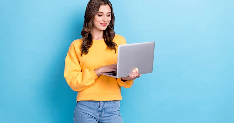 “Young professional browsing remote job opportunities on her laptop.”
