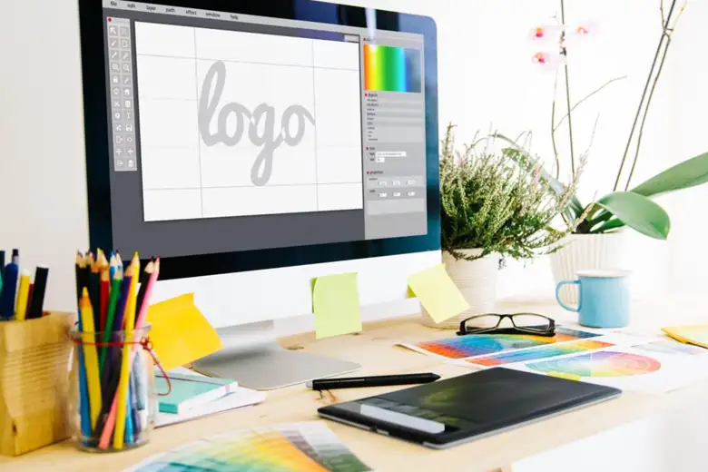 A computer monitor displaying a logo related to ai in logo design.