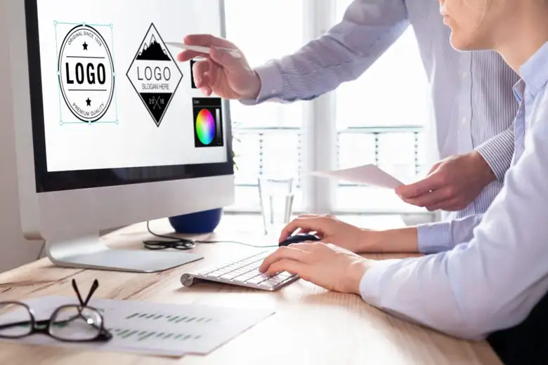 A computer monitor displaying a logo related to ai in logo design.