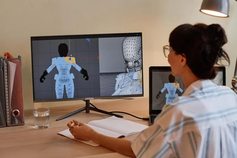A designer working on a 3D character design A designer working on a 3D character design
