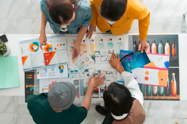 A group of product packaging designers working on a project A group of product packaging designers working on a project