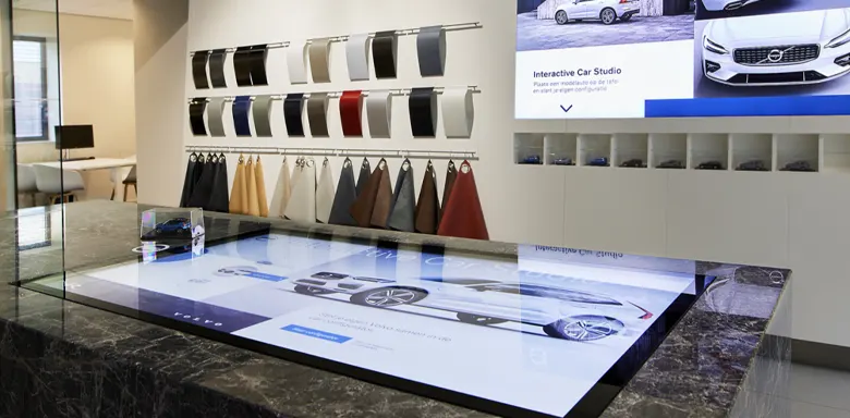 Image of a hybrid showroom design and digital displays with material samples.