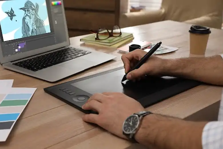 Graphic designer using adobe illustrator to create animated characters.
