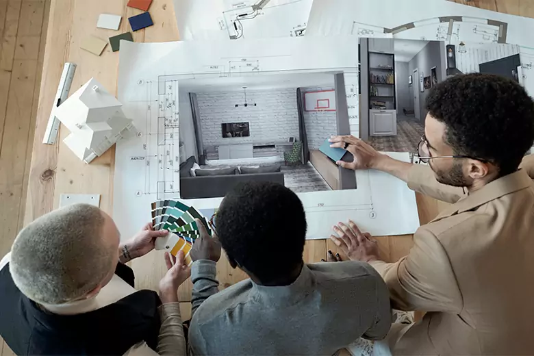 A team of interior stylists finalizing designs for a living room.
A team of interior stylists finalizing designs for a living room.