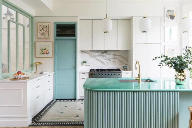 A modern kitchen featuring white cabinets, highlighting contemporary furniture design elements.
