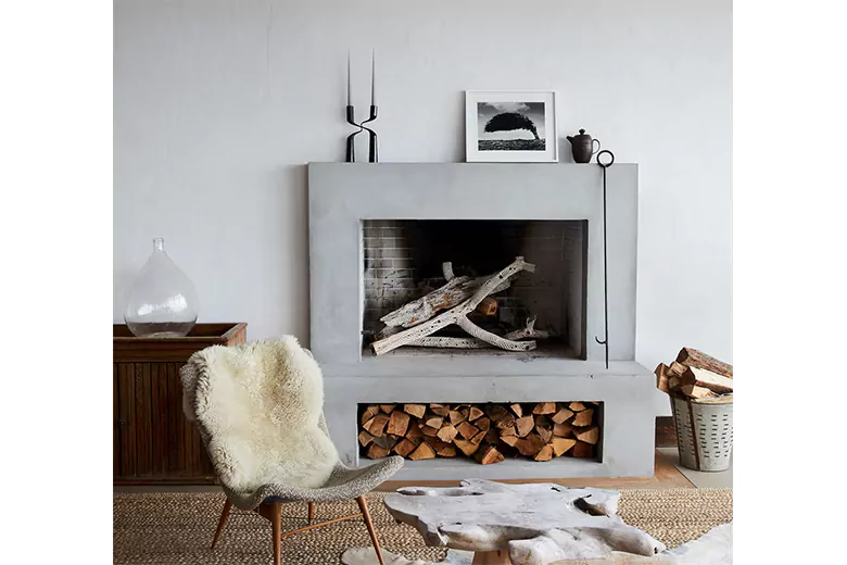 Scandinavian living room with a floating fireplace Scandinavian living room with a floating fireplace