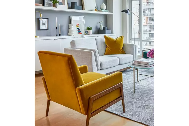 Modern living space featuring a yellow armchair and neutral-toned sofa.