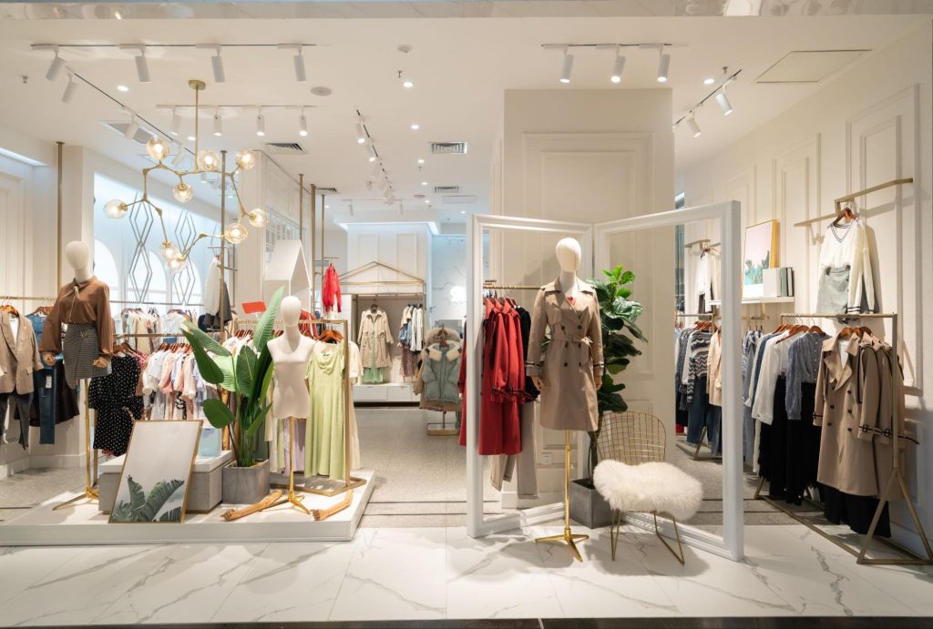 Picture of mannequins featuring visual merchandiser displays with stylish outfits.