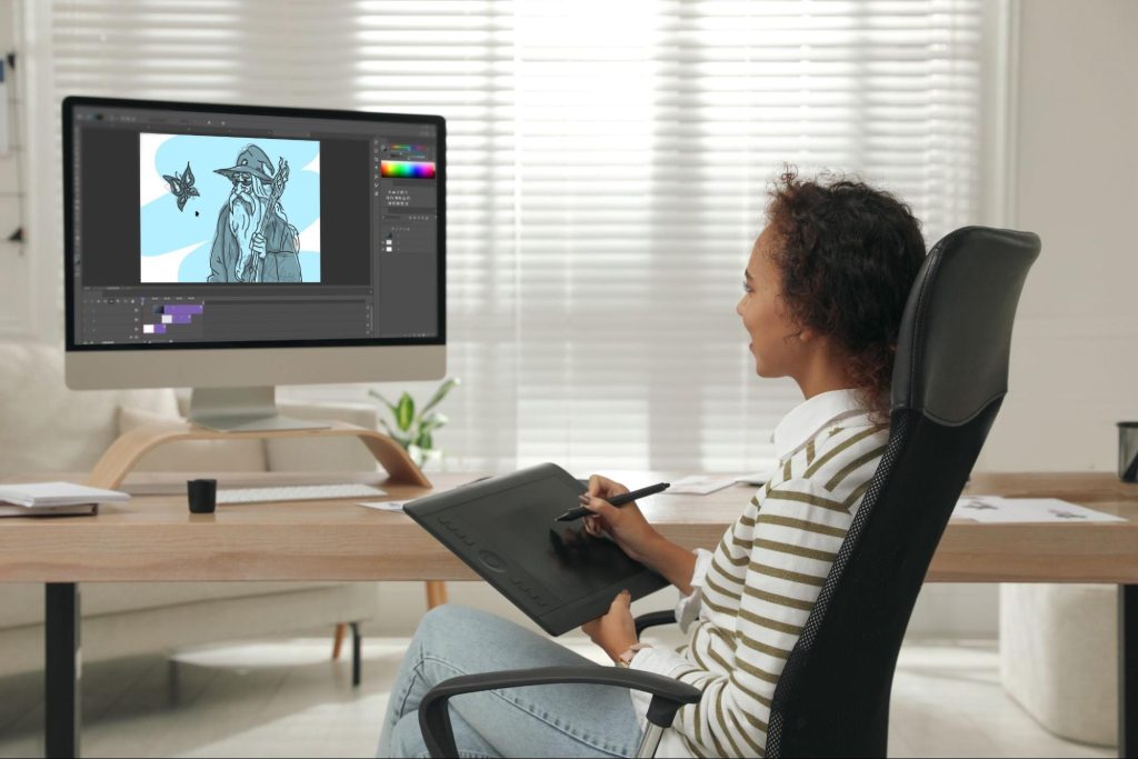 Picture of a motion graphic designer, who is engaged in her work at her computer.