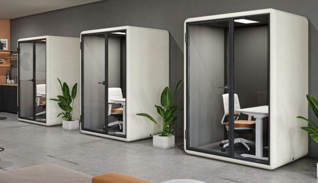 Three modular furniture office design pods with glass doors and small desks. Three modular furniture office design pods with glass doors and small desks.
