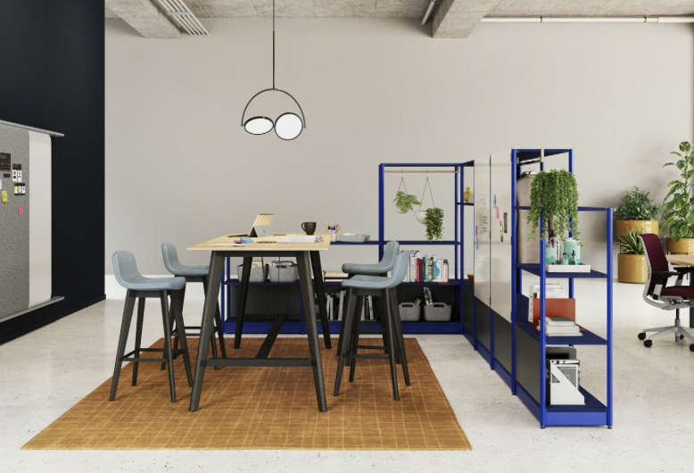 Image of office furniture with a high table, stools, and modular shelving units. Image of office furniture with a high table, stools, and modular shelving units.