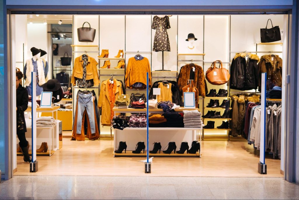 Picture of a storefront that displays apparel styled by a visual merchandiser
