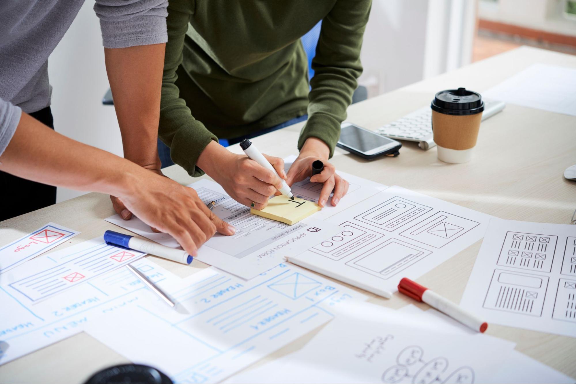 Product designers working on a wireframe Product designers working on a wireframe