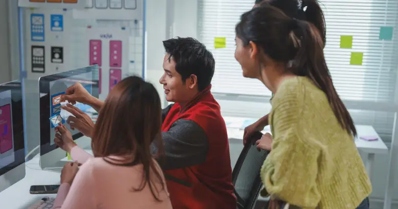 A group of designers working on a Agile UX project