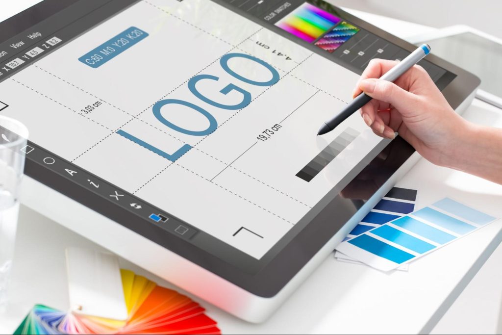 A designer using software to design a logo
A designer using software to design a logo
