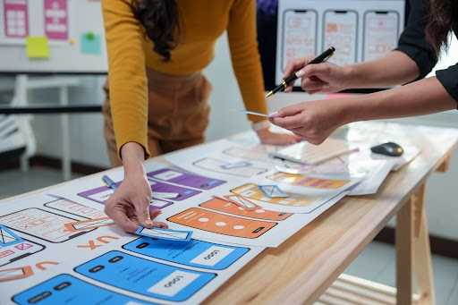 Designers focusing on adding interactivity for better user experience in web interfaces.
Designers focusing on adding interactivity for better user experience in web interfaces.