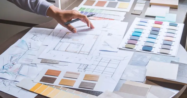 Picture of an interior designer who is sorting colors for his project.