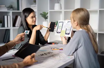 UX designers collaborating on inclusive design strategies for an upcoming product.