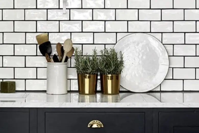 Kitchen with a white subway tile backsplash.
