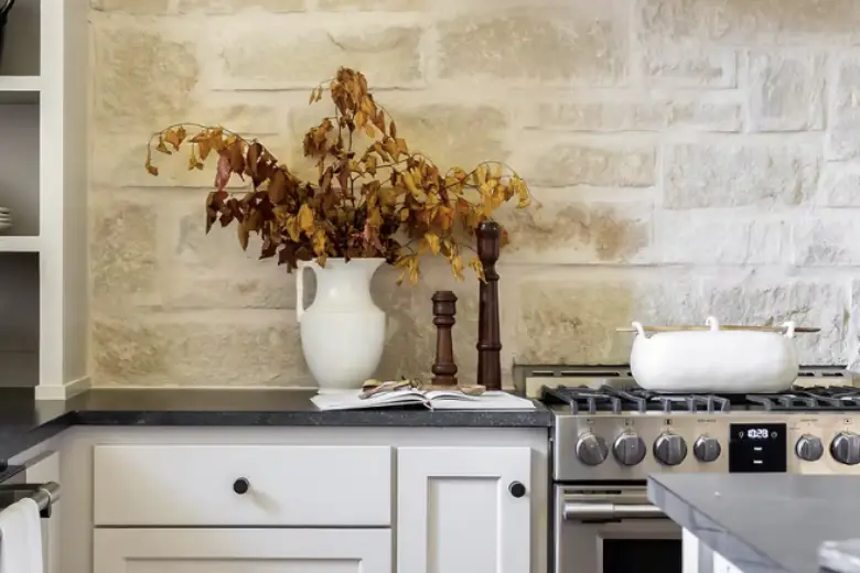 Picture of a Kitchen with natural stone tile backsplash.
