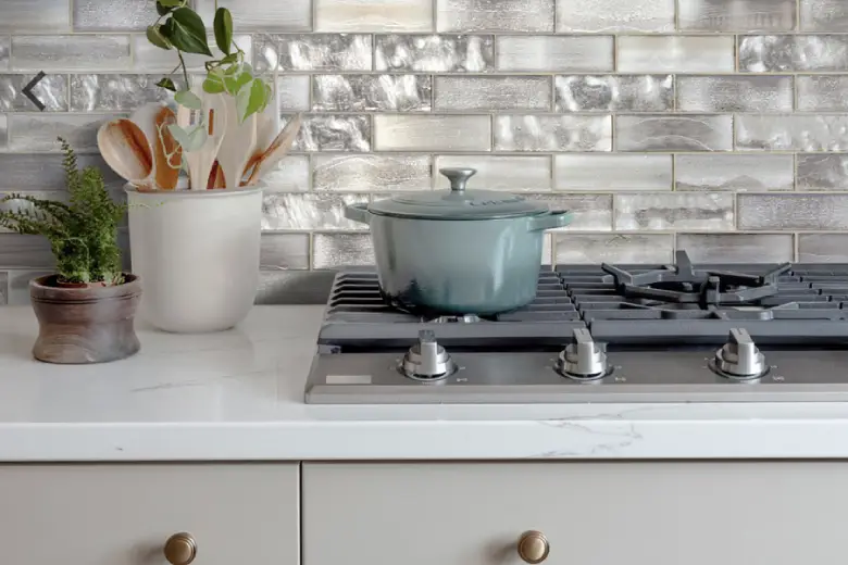 Picture of a kitchen with textured glass tile backsplash.
