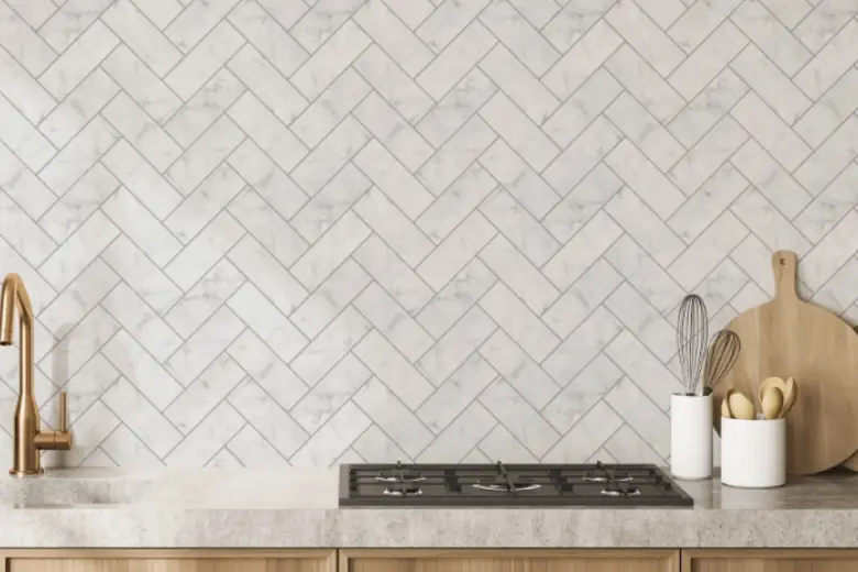Kitchen with a marble herringbone backsplash.
