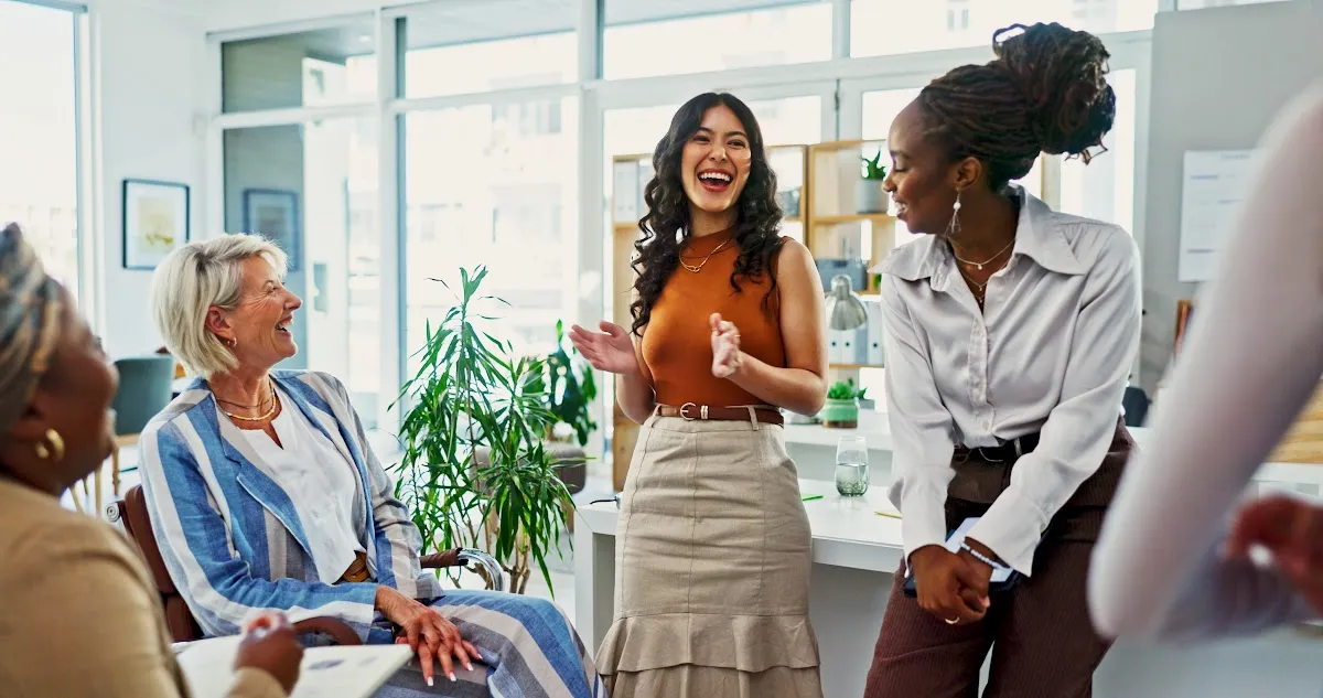 Employees laughing at a viral meme, while balancing cultural sensitivity and relatable humor. Employees laughing at a viral meme, while balancing cultural sensitivity and relatable humor.