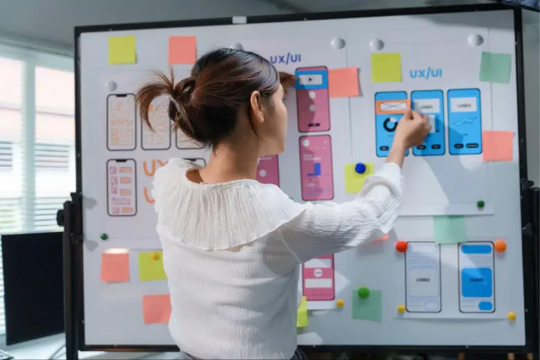 Picture of a woman working on a UI UX design project for a digital marketing agency.
