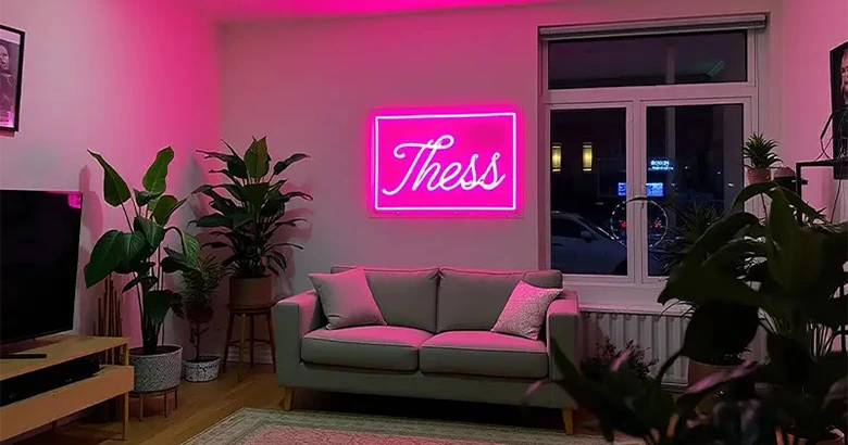 Pink custom neon sign in a home lounge, adding a vibrant and cozy look.