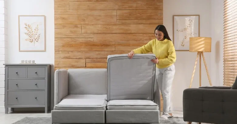 A woman integrating smart home furniture in her living room