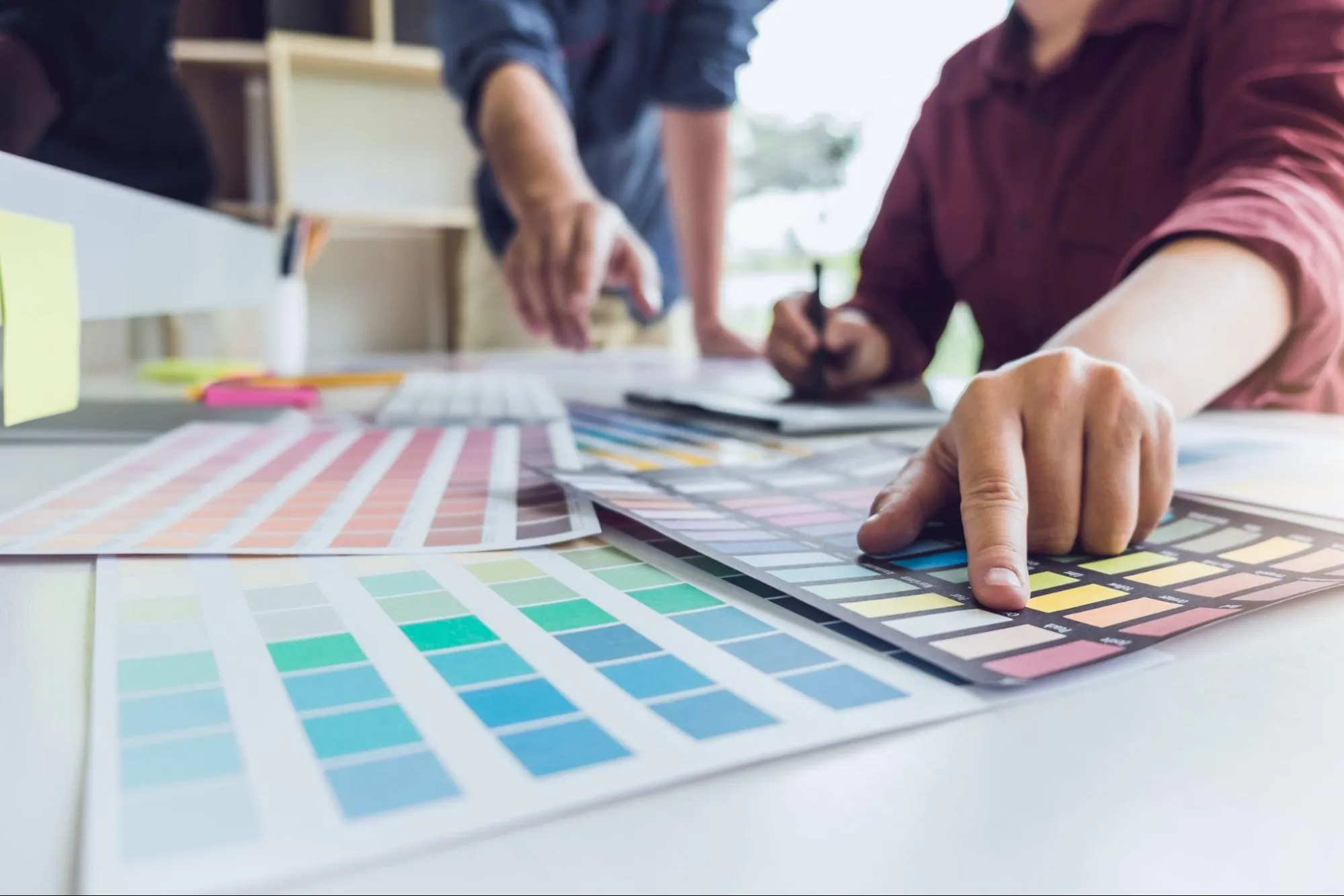Designer choosing color palette for an advertising design Designer choosing color palette for an advertising design