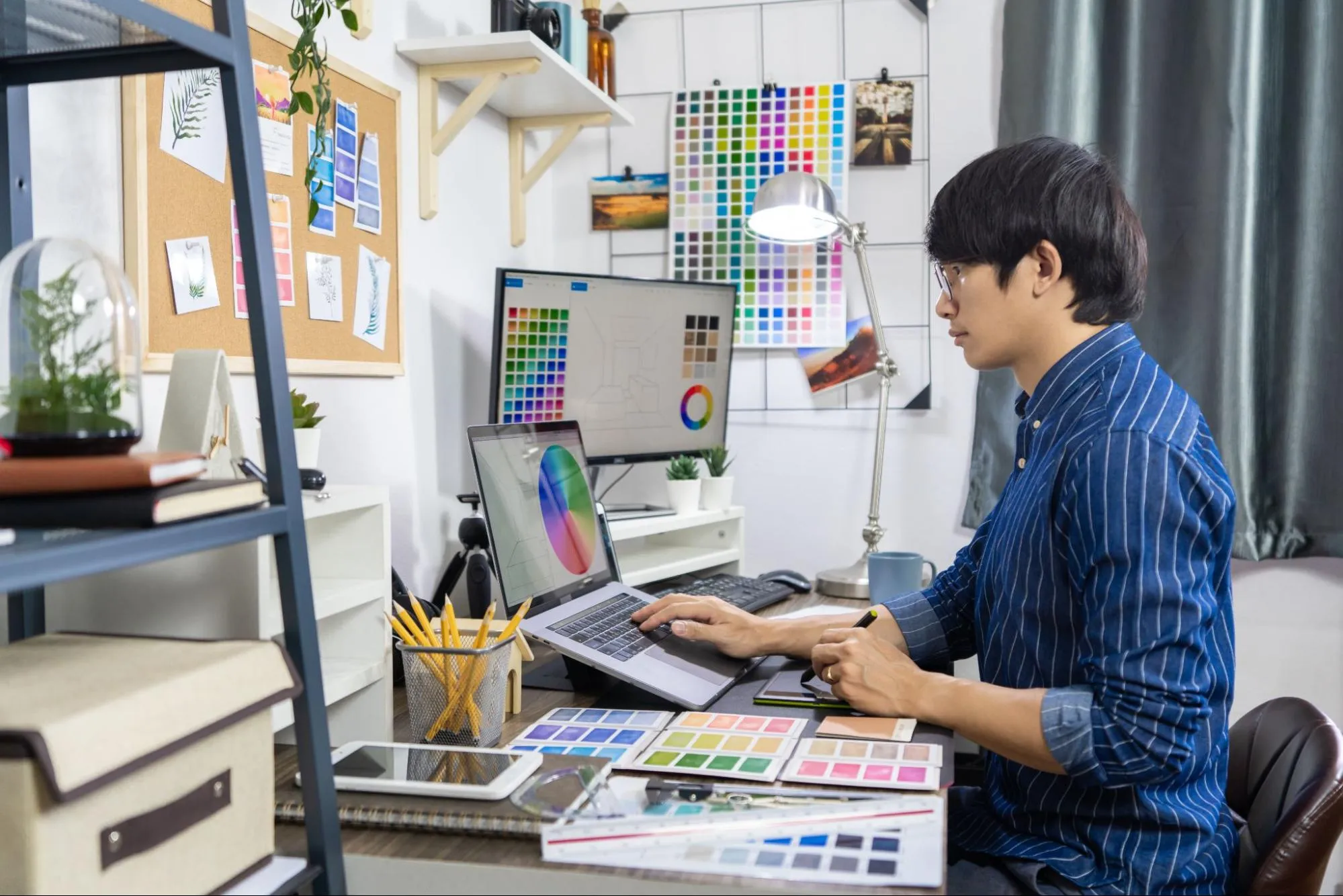 A graphic designer working on creating an ad
A graphic designer working on creating an ad