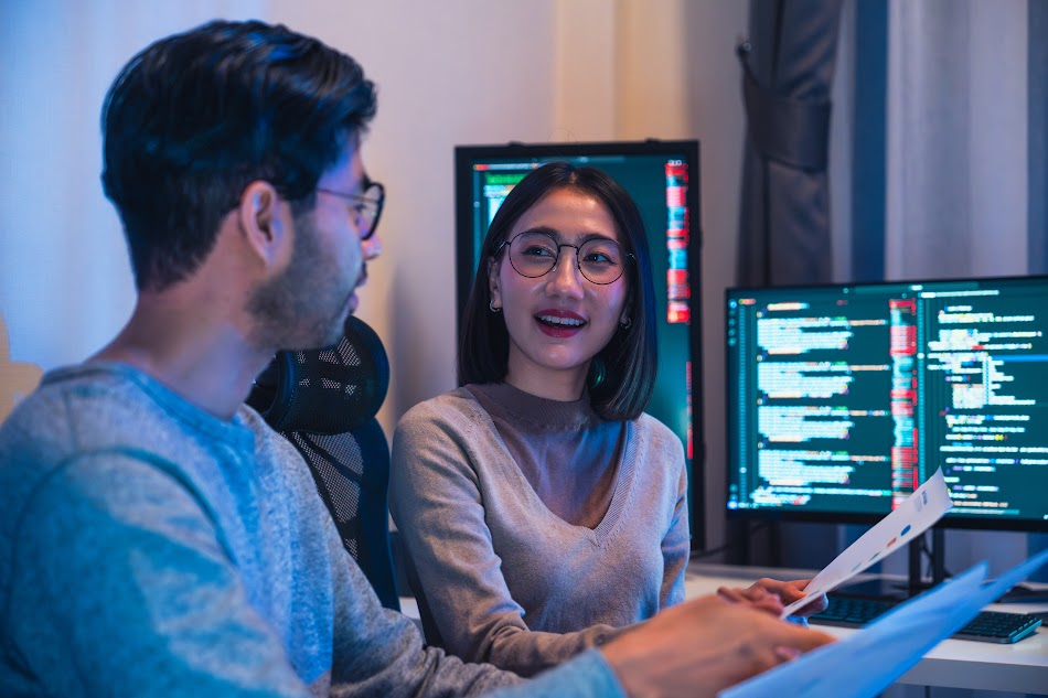 Designers interacting with generative AI software to build adaptive and innovative user interfaces.