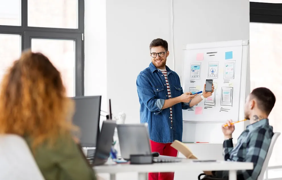 Mentor explaining essential soft skills to help a UI UX designer stand out.
Mentor explaining essential soft skills to help a UI UX designer stand out.
