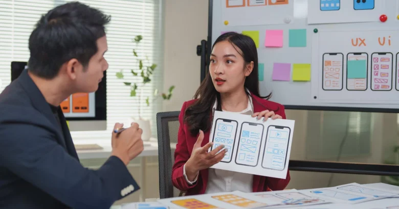 A UI UX designer showing the wireframe of an app.