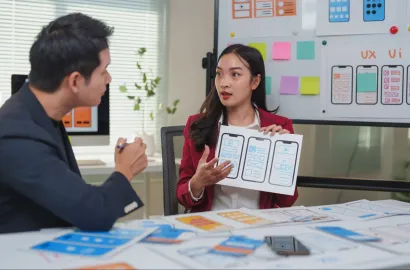 A UI UX designer showing the wireframe of an app.