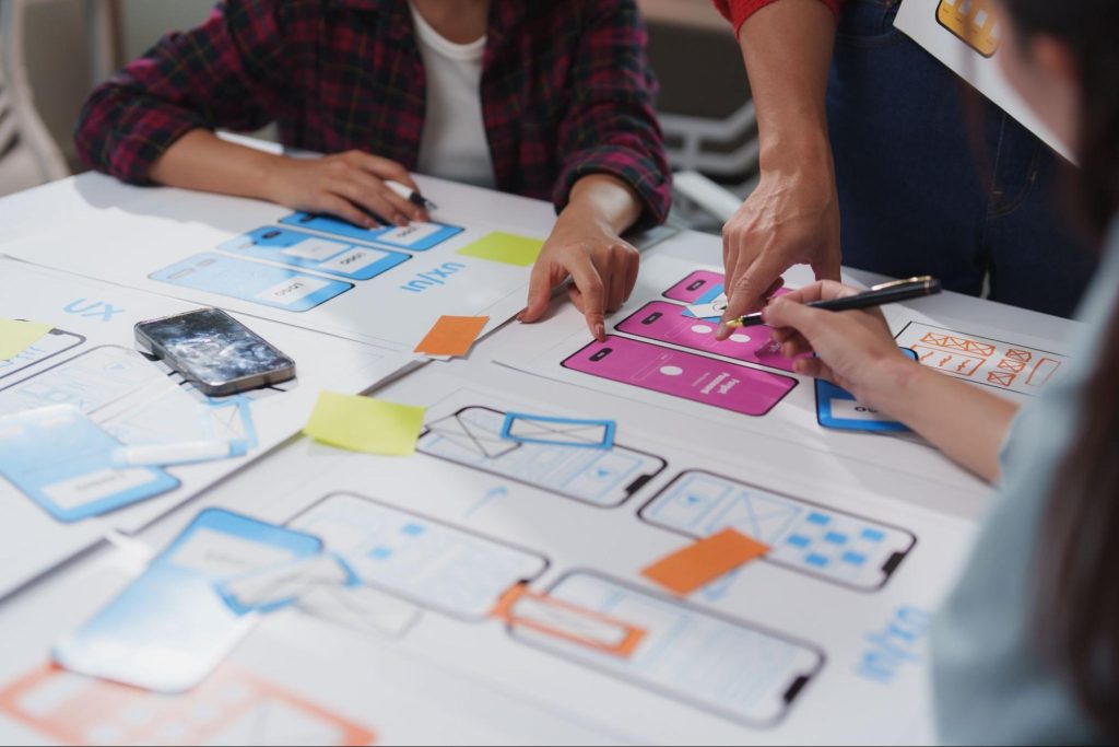UI UX designers working on a wireframe.
