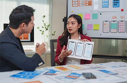 A UI UX designer showing the wireframe of an app.