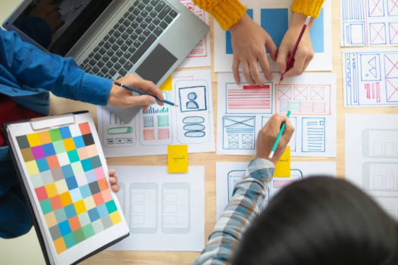 A team of Graphic Designers creating wireframes A team of Graphic Designers creating wireframes