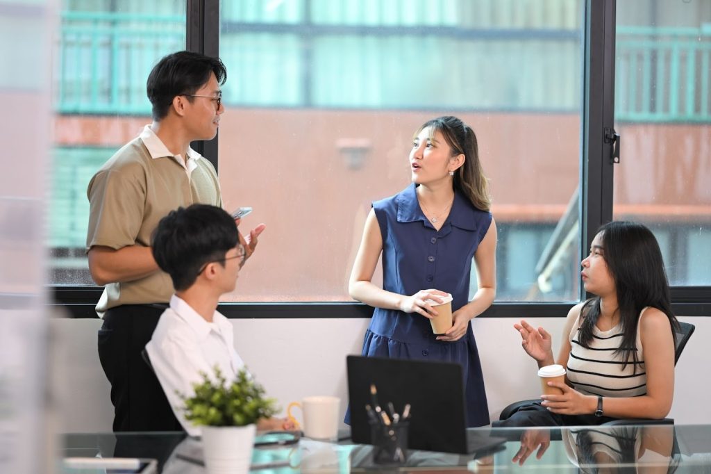 Design students discussing UI UX design trends
