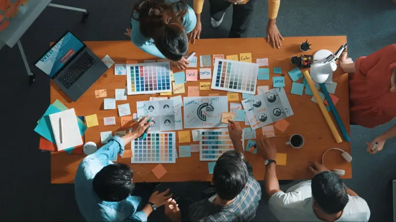 Graphic Designers and UI UX designers collaborating on a project
Graphic Designers and UI UX designers collaborating on a project